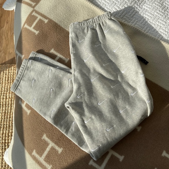 Nike Other - Nike All Over Embroidered Swoosh Sweatpant Grey  M